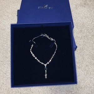 Silver necklace with blue stone